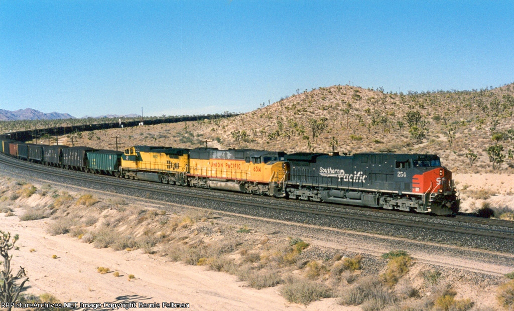 Southern Pacific AC44CW #254 (with UP SD60M #6314 & CNW C44-9W #8602) with a loaded westbound coal train 